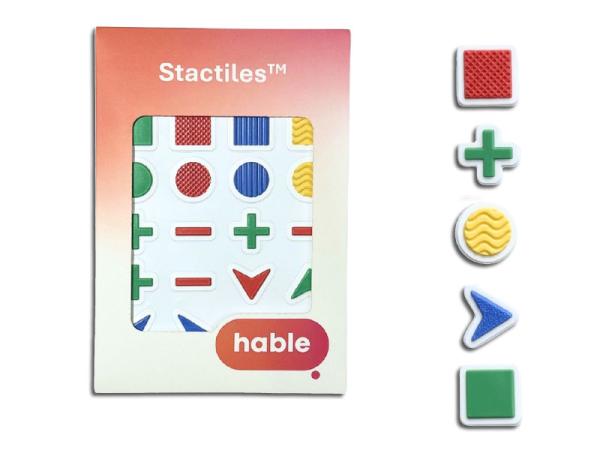 Verpackung mit dem Aufdruck Stactiles zeigt ein Set taktiler Aufkleber in verschiedenen Formen und Farben